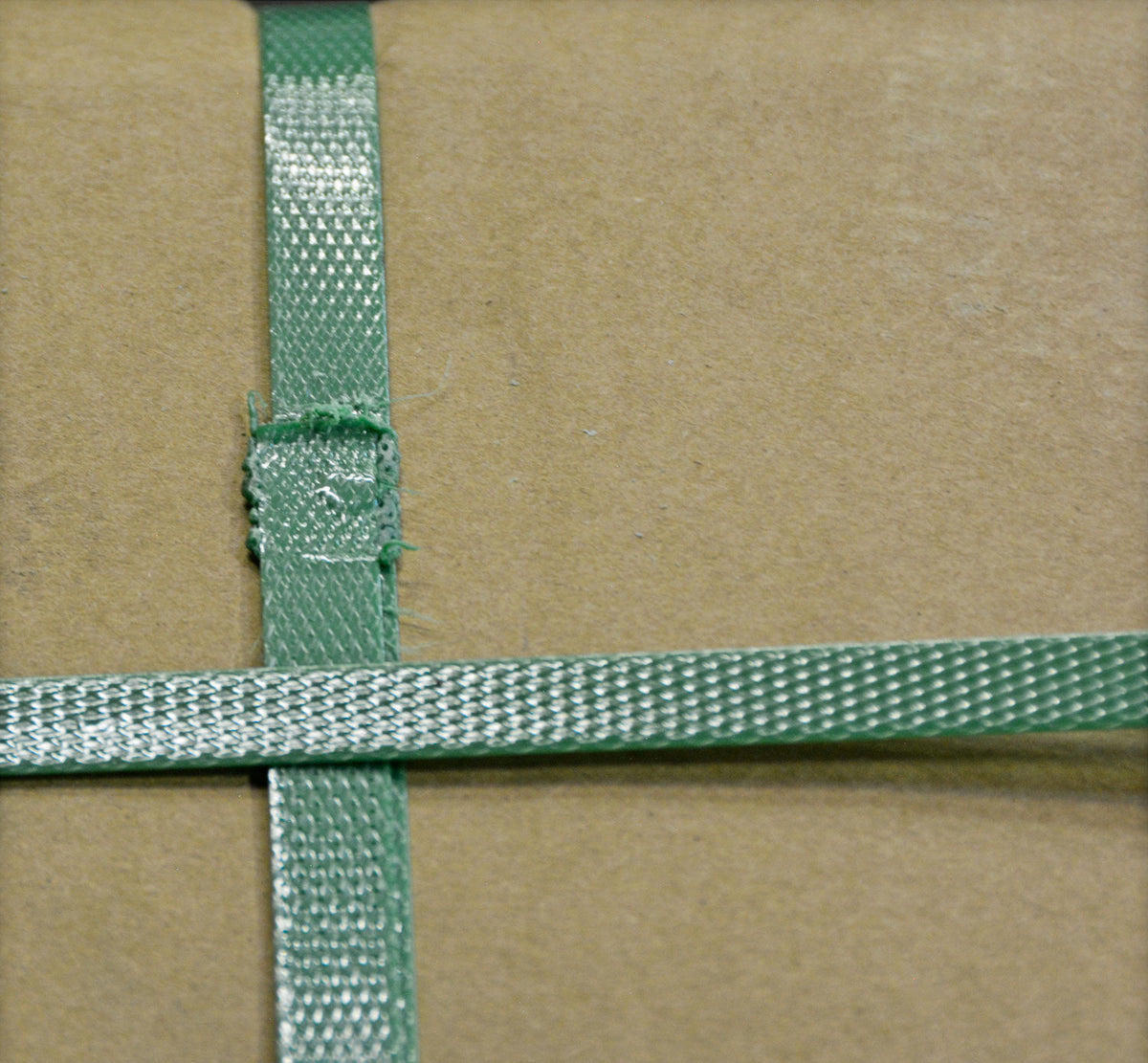 Green Plastic Strapping on box